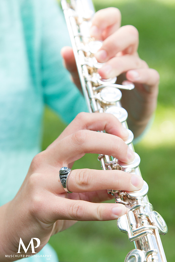 Band senior portraits with flute and class ring at Inniswood Metro Gardens Park.